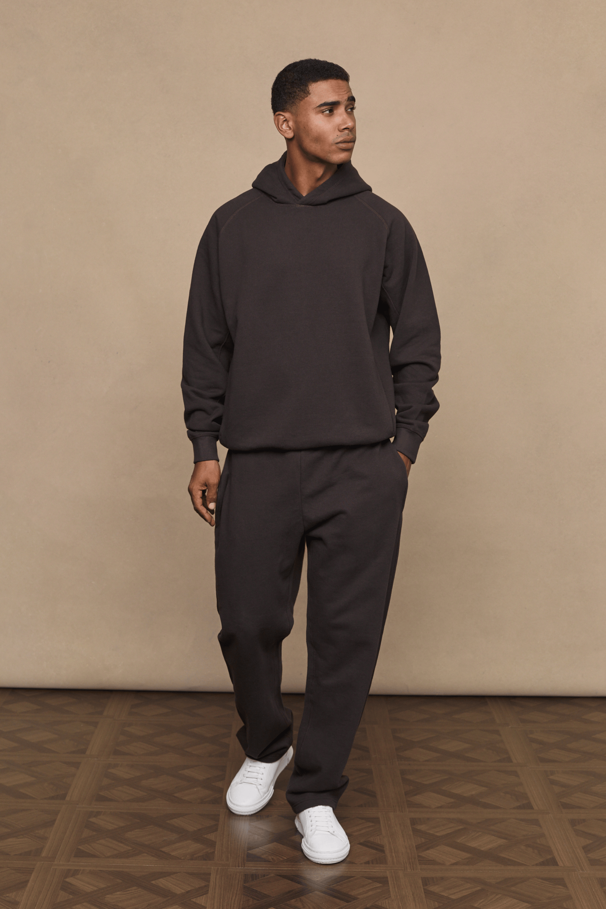 Men’s heavyweight cotton blend hoodie in dark brown with raglan sleeves by Raith