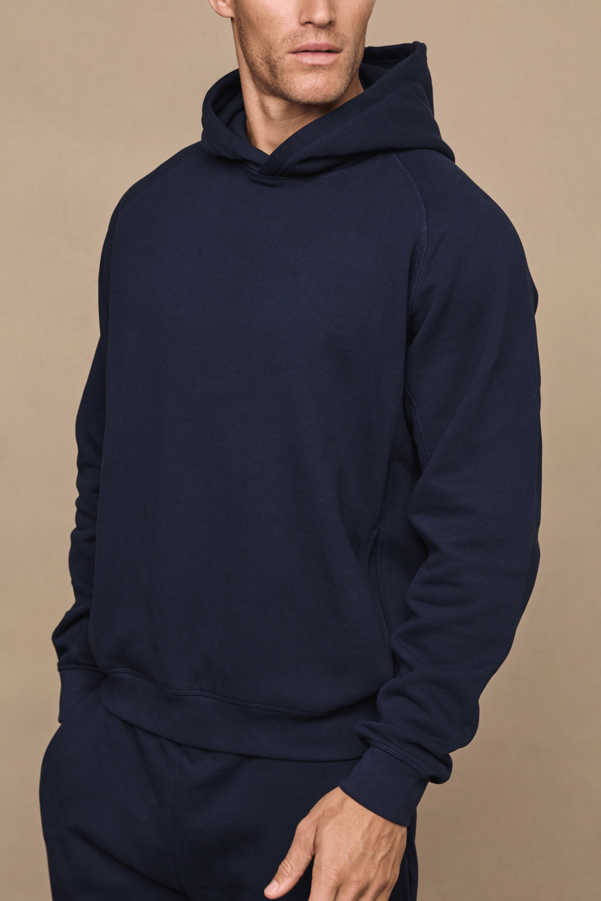 Men’s heavyweight cotton blend hoodie in navy with raglan sleeves by Raith