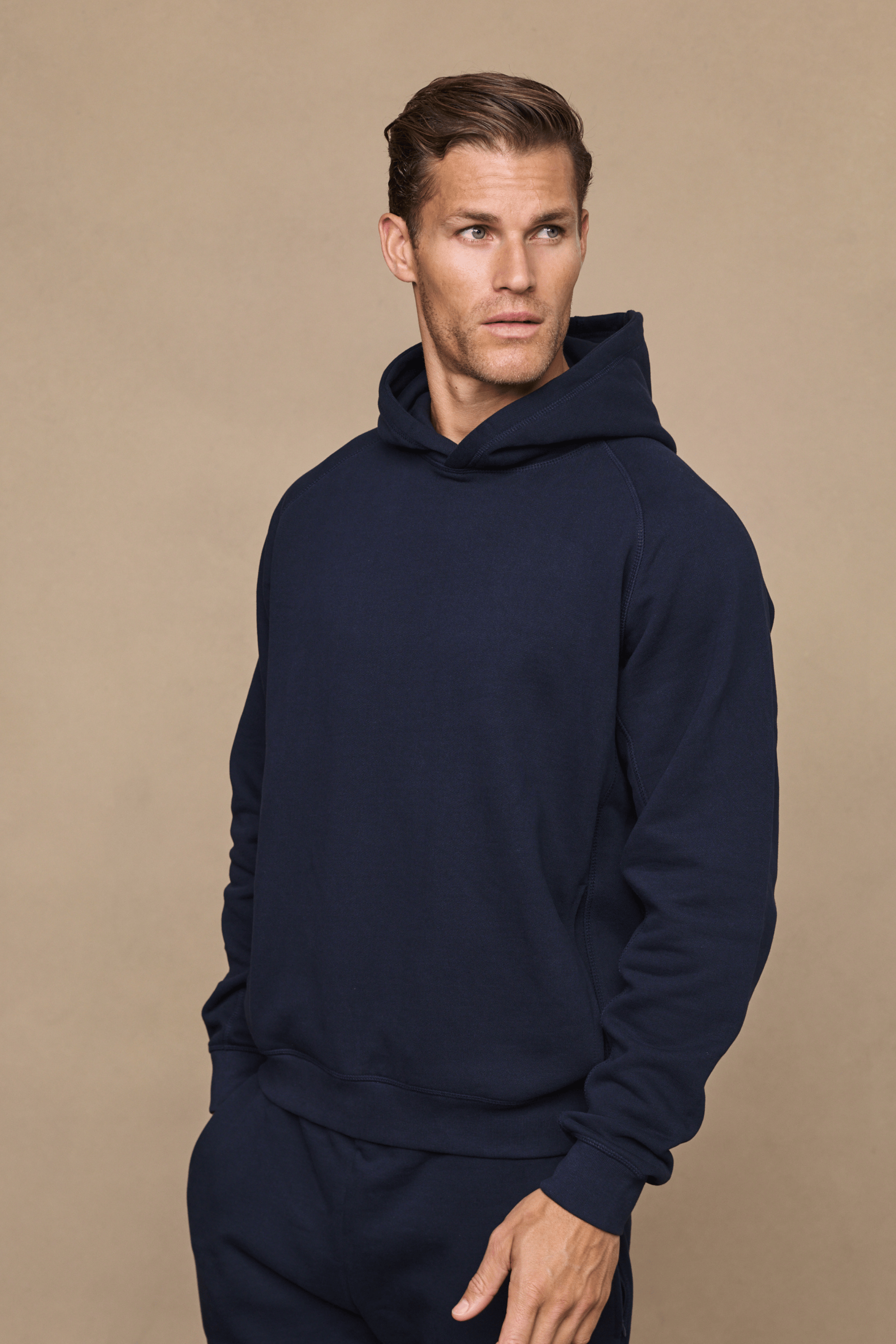 Men’s heavyweight cotton blend hoodie in navy with raglan sleeves by Raith