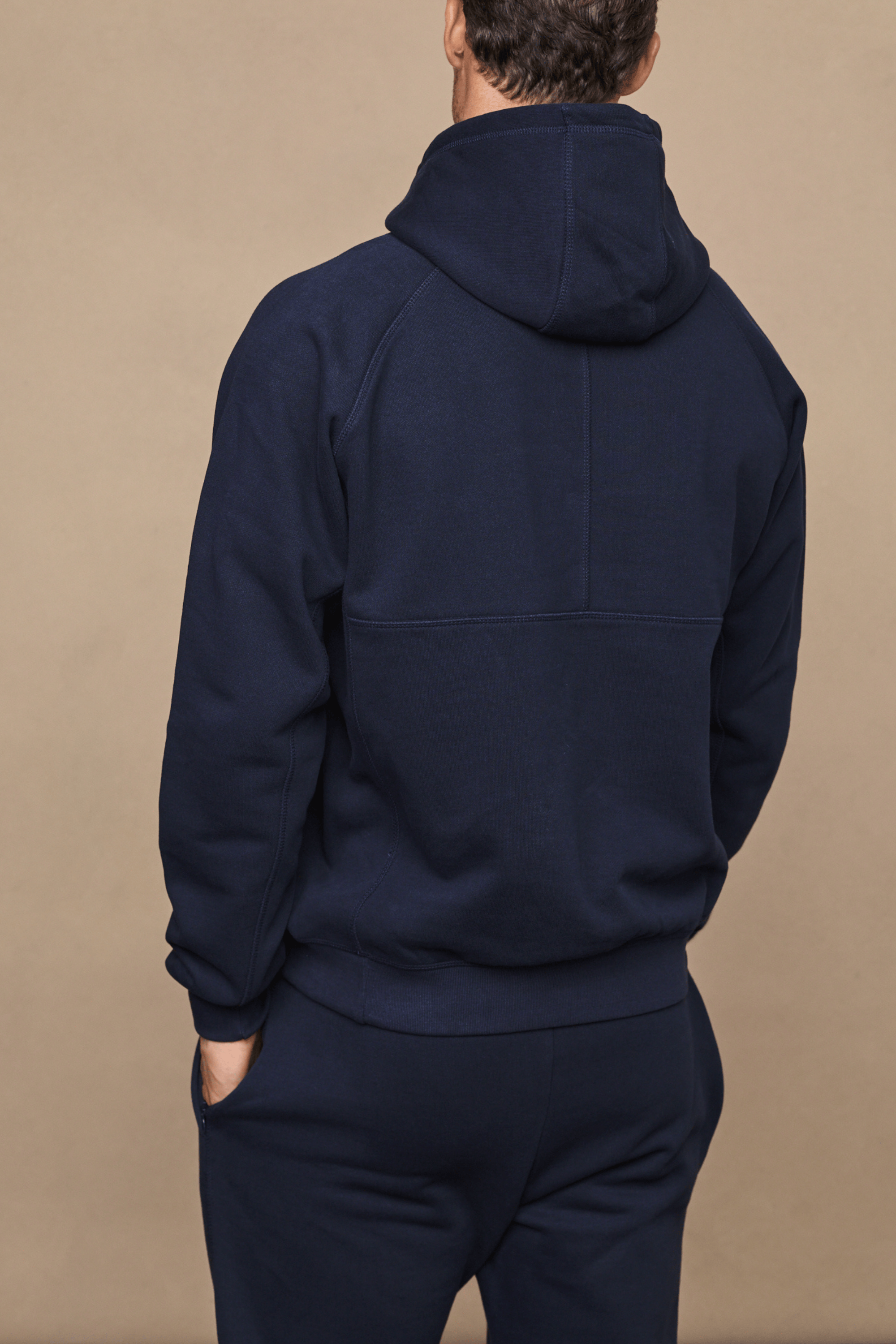 Men’s heavyweight cotton blend hoodie in navy with raglan sleeves by Raith