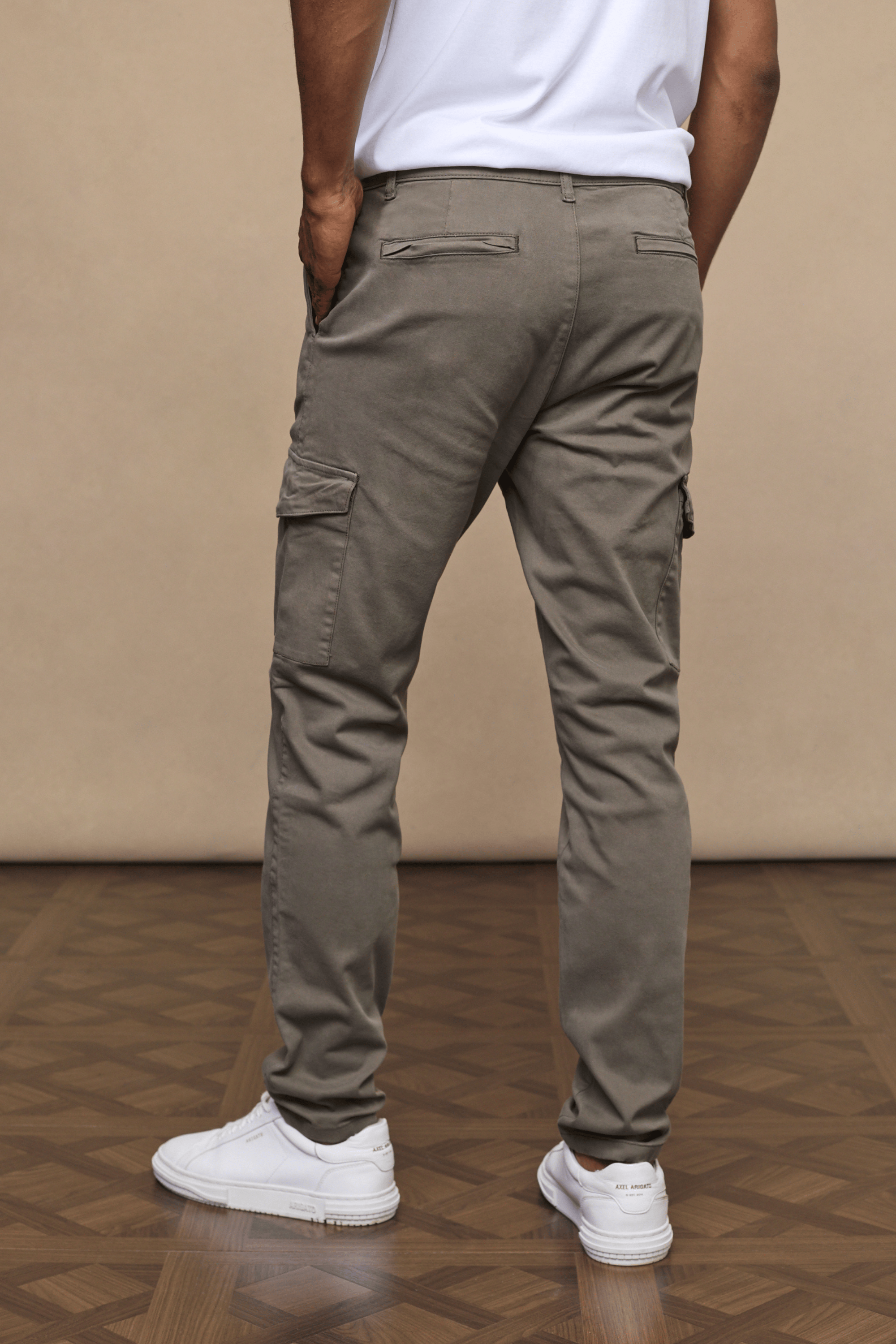 Men’s cotton stretch cargo trousers in dark olive with straight leg fit and utility pockets by Raith