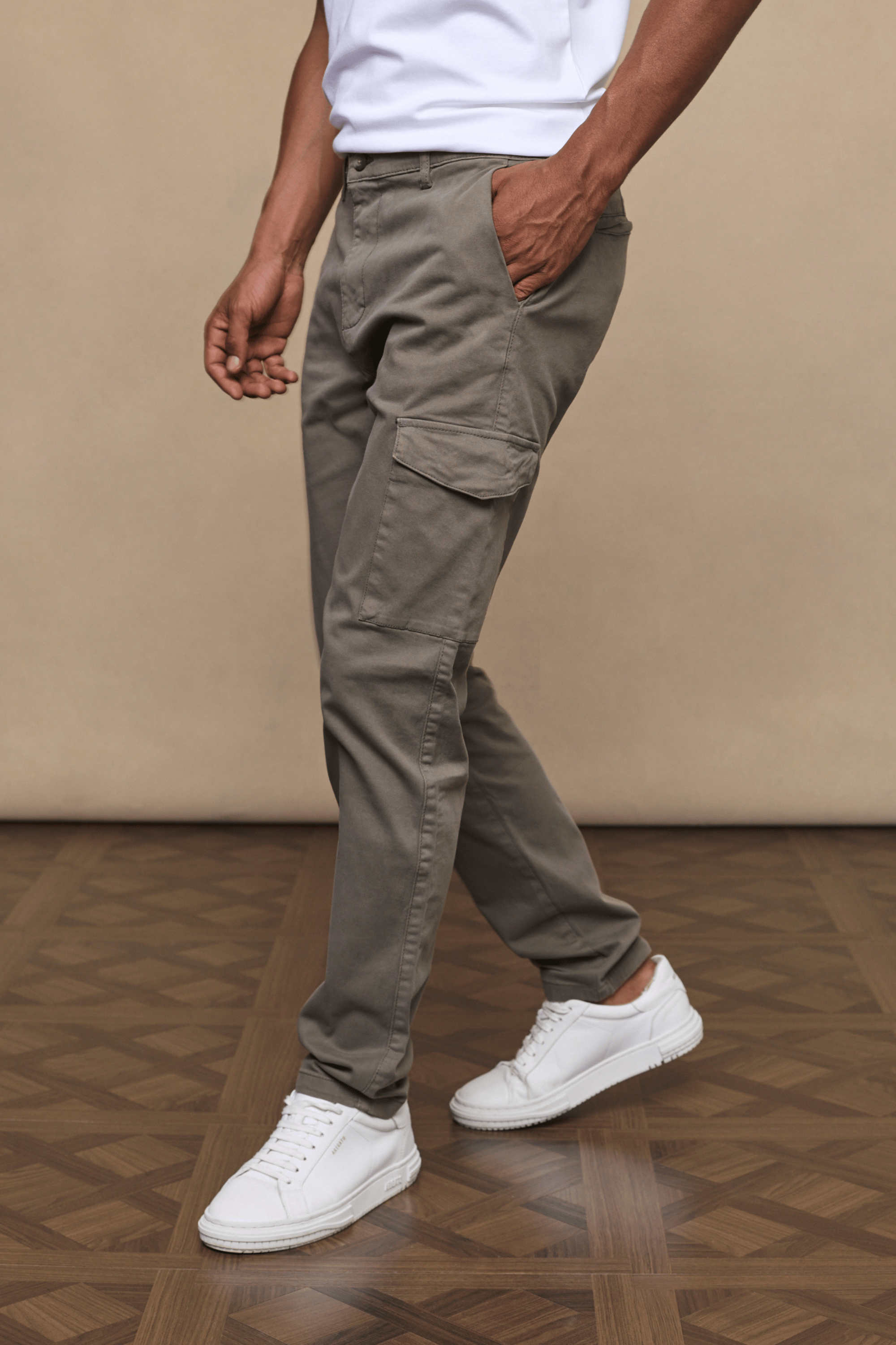 Men’s cotton stretch cargo trousers in dark olive with straight leg fit and utility pockets by Raith