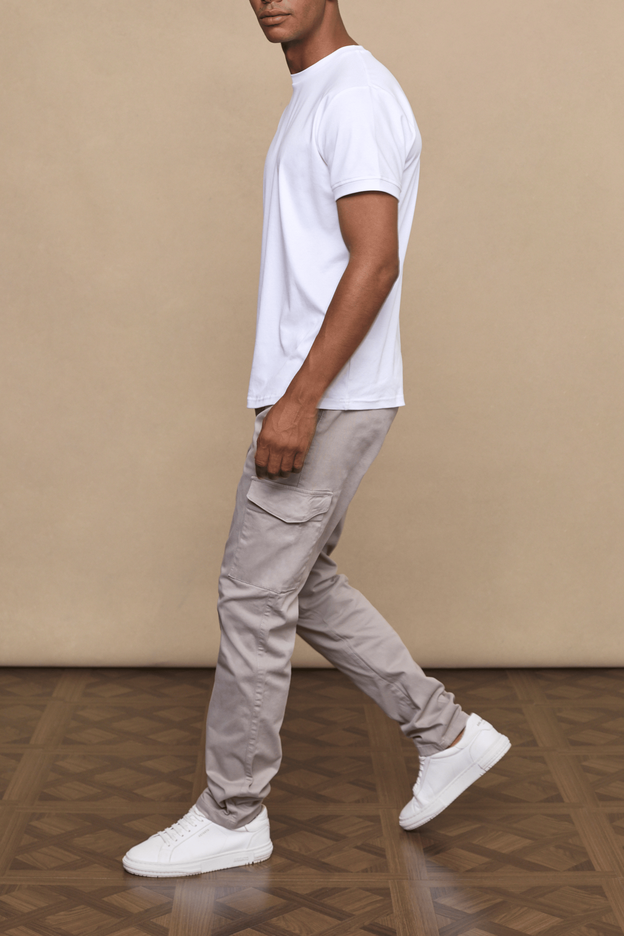 Men’s cotton stretch cargo trousers in greige with straight leg fit and utility pockets by Raith