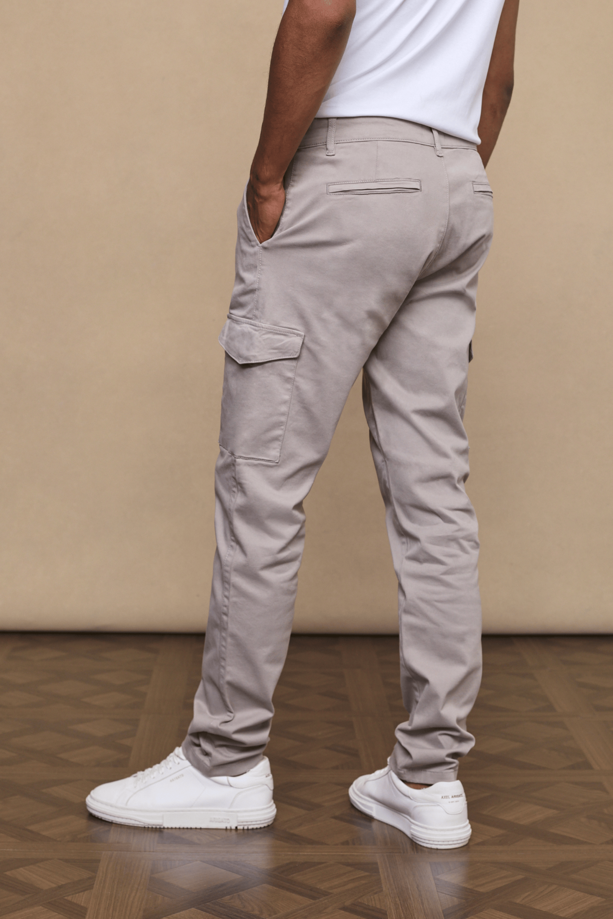 Men’s cotton stretch cargo trousers in greige with straight leg fit and utility pockets by Raith