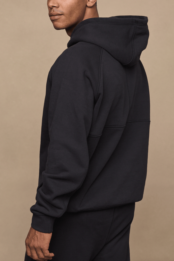 Men’s heavyweight cotton blend hoodie in Black with raglan sleeves by Raith