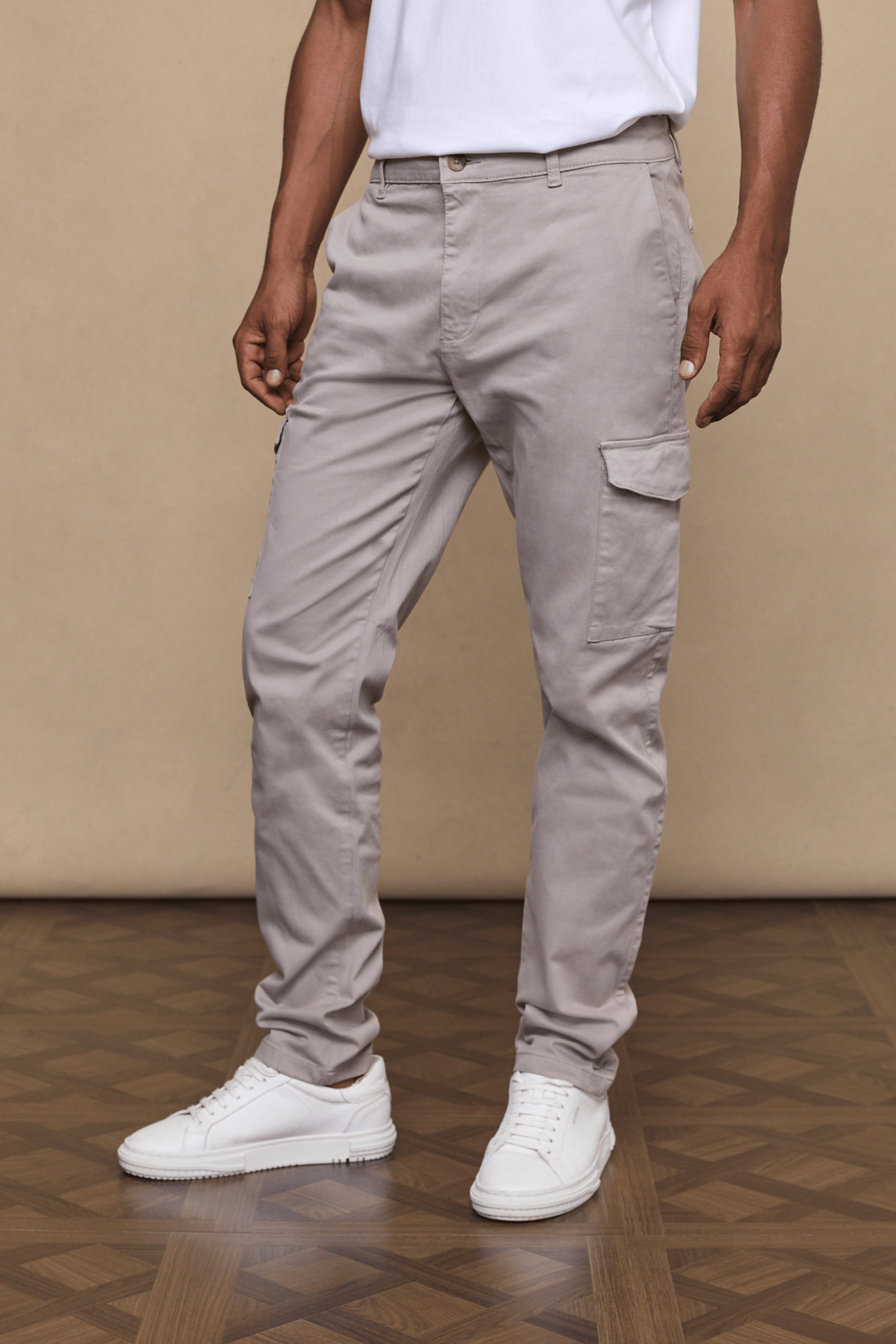 Men’s cotton stretch cargo trousers in greige with straight leg fit and utility pockets by Raith